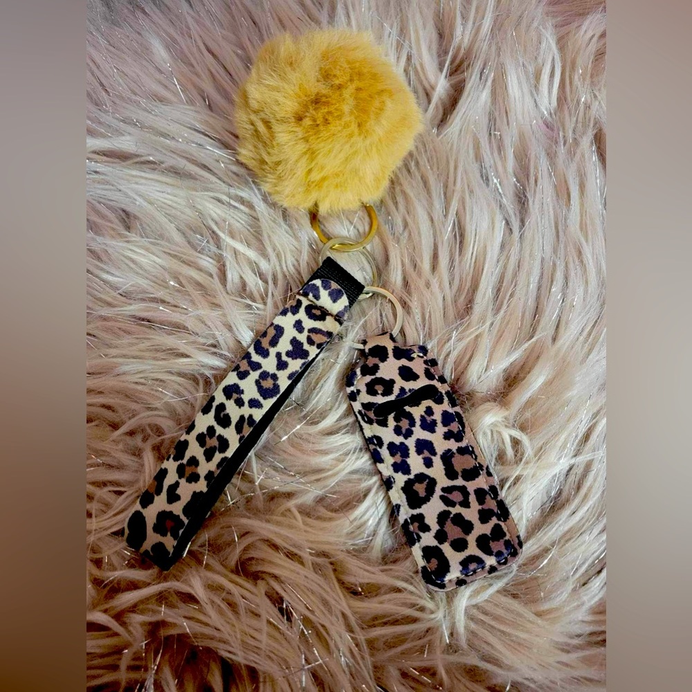 Cheetah print chapstick holder wristlet with fuzzy ball